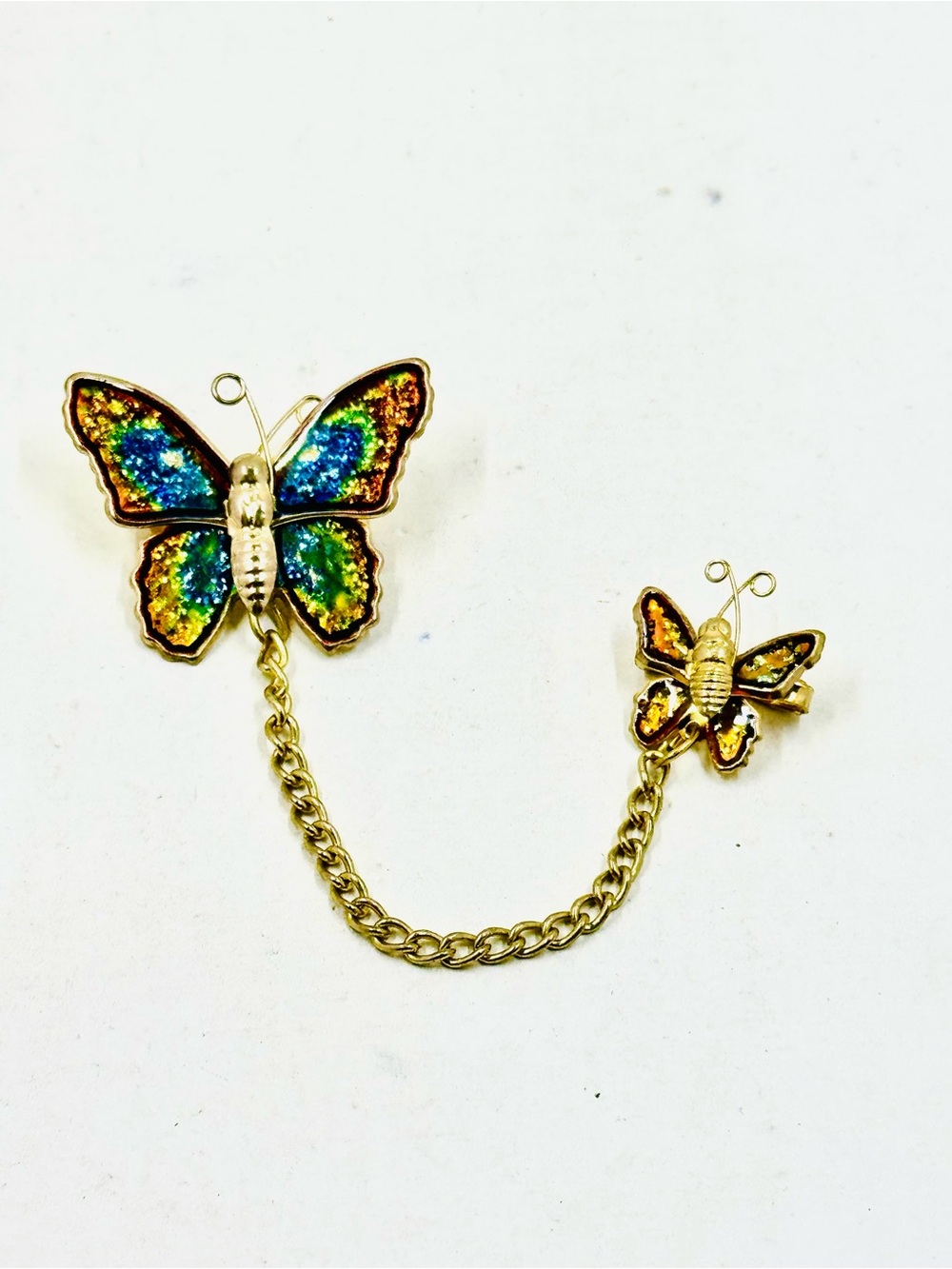 Gold Tone Double Butterfly Chain Brooch with Multicolor Rainbow Enamel Wings